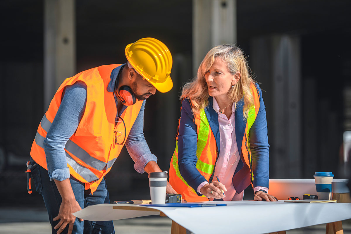 woman and man looking at plans 